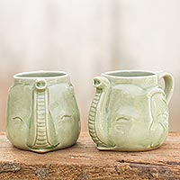 Celadon ceramic mugs, 'Elephant Greeting' (pair) - Celadon Ceramic Mugs (Pair)