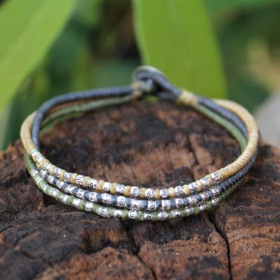 Silver accent braided bracelet, 'Thai Forest Flowers' - Silver Accent Braided Bracelet