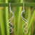 Sterling silver dangle earrings, 'Gentle Sigh' - Handcrafted Modern Sterling Silver Dangle Earrings thumbail