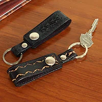 Leather key rings, 'Key to Success in Black' (pair) - Hand Tooled Black Leather Key Rings (Pair)