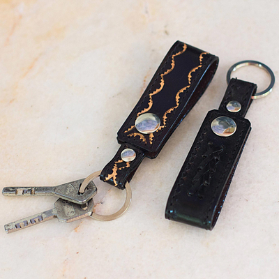 Leather key rings, 'Key to Success in Black' (pair) - Hand Tooled Black Leather Key Rings (Pair)