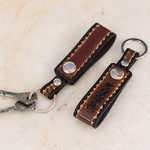 Leather key rings, 'Key to Success in Brown' (pair) - Hand Tooled Brown Leather Key Rings (Pair)
