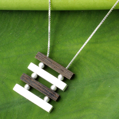 Sterling silver and wood pendant necklace, 'Nature's Balance' - Artisan Crafted Necklace Sterling Silver and Wood