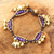 Brass charm bracelet, 'Fortune's Melody' - Elephant and Bell Charm Bracelet in Purple Quartz and Brass thumbail