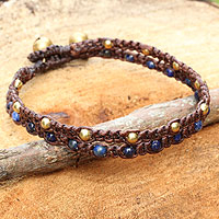 Lapis lazuli braided bracelet, 'Blue Boho Chic' - Braided Lapis Lazuli and Brass Wristband from Thailand