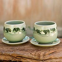 Celadon ceramic teacups and saucers, Prancing Elephants (pair)