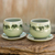 Celadon ceramic teacups and saucers, 'Prancing Elephants' (pair) - Green Celadon Elephant Teacups and Saucers (Set for 2)