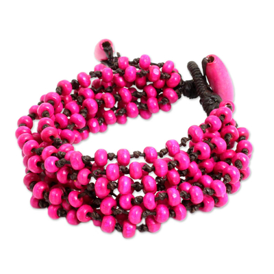 Wood beaded bracelet, 'Opulent Pink' - Hot Pink Hand Knotted Beaded Bracelet