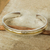 Gold accent sterling silver cuff bracelet, 'Ripple Effect I' - Gold Accent Sterling Silver Hammered Cuff Bracelet