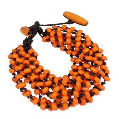 Wood beaded bracelet, 'Lamphan Belle' - Orange Torsade Bracelet Wood Beaded jewellery