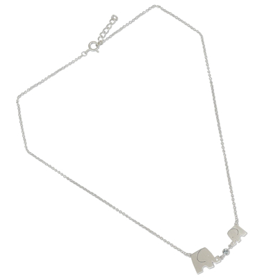 Blue topaz pendant necklace, 'Family Love' - Elephant Family Sterling Silver Pendant Necklace