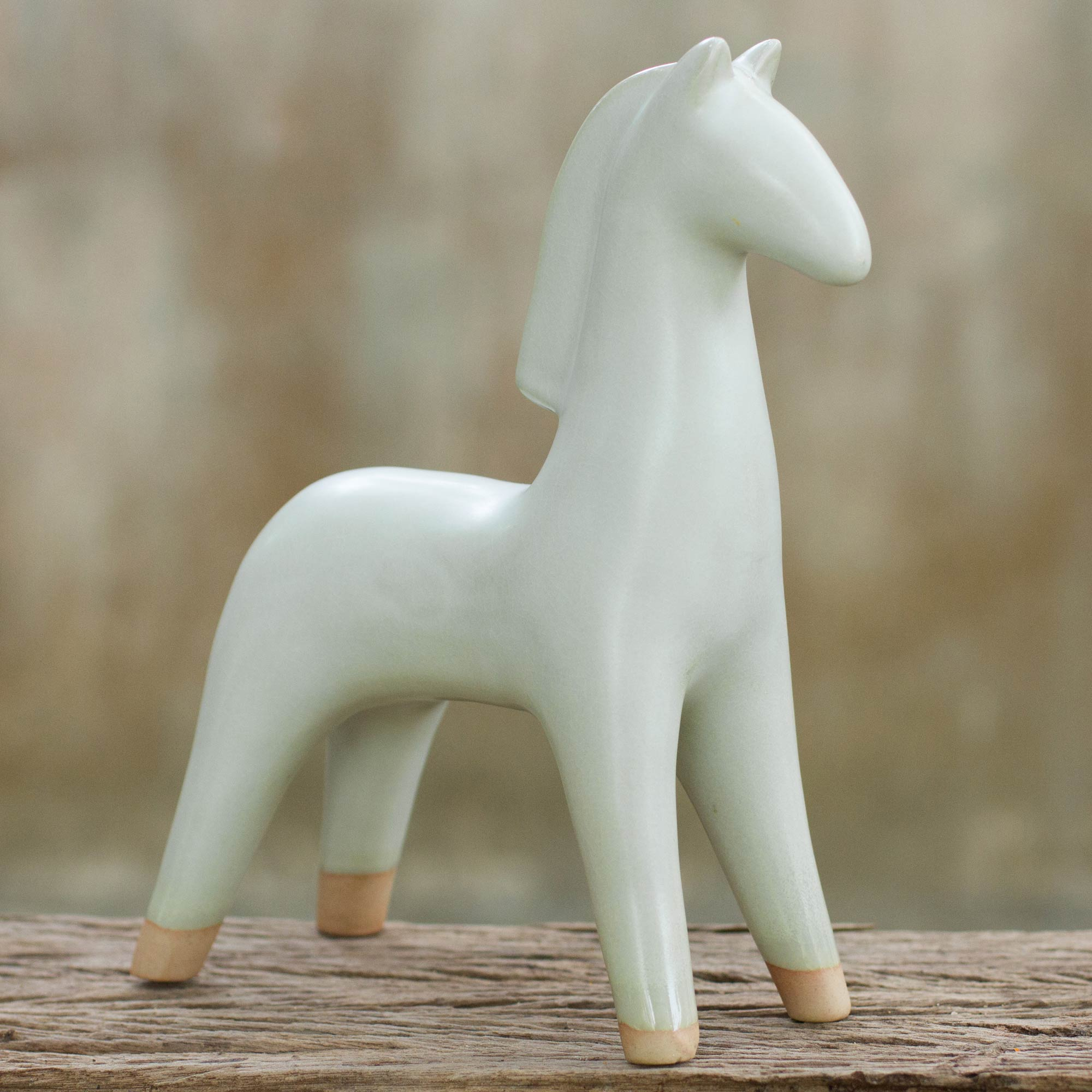 white ceramic horse statue