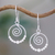Sterling silver dangle earrings, 'Whirl' - Handcrafted Sterling Silver Dangle Earrings with Spirals thumbail