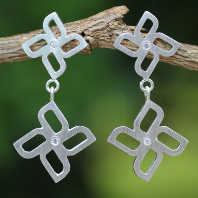 Sterling silver dangle earrings, 'Playful Pinwheel' - Brushed Silver Dangle Earrings with White Topaz Gemstones