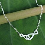 Sterling silver pendant necklace, 'Into Infinity' - Brushed Sterling Silver Necklace with Infinity Symbols