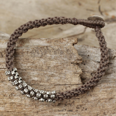Silver beaded cord bracelet, 'Tribal Flowers in Taupe' - Braided Gray Cord Bracelet with Silver 950 Floral Beads