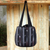 Cotton shoulder bag, 'Orient Black' - Dark Ikat Style Hand Woven Cotton Shoulder Bag with Pockets