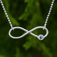 Sterling silver and blue topaz pendant necklace, 'Pure Infinity' - Sterling Silver Infinity with Blue Topaz Pendant Necklace