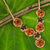 Carnelian and garnet flower necklace, 'Floral Garland in Orange' - Beaded Carnelian and Garnet Floral Pendant Necklace thumbail