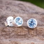 Blue topaz stud earrings, 'Light' - Sterling Silver Stud Earrings with Faceted Blue Topaz