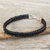 Braided leather bracelet, 'Assertive in Black' - Thai Black Leather Braided Bracelet with Silver Clasp (image 2) thumbail