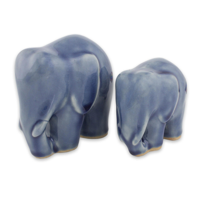 Celadon ceramic figurines, 'Elephant Bond in Dark Blue' (pair) - Handmade Blue Celadon Ceramic Elephant Figurines (Pair)