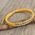 Armband mit silbernem Akzent - Handgeknüpftes gelbes Thai-Armband mit Silber 950