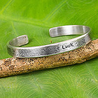 Sterling silver cuff bracelet, 'Wishing You Luck' - Handcrafted Sterling Silver Good Luck Cuff Bracelet