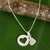 Sterling silver heart necklace, 'Soul Mates in the Moon' - Thai Double Heart Pendants on Sterling Silver Necklace thumbail