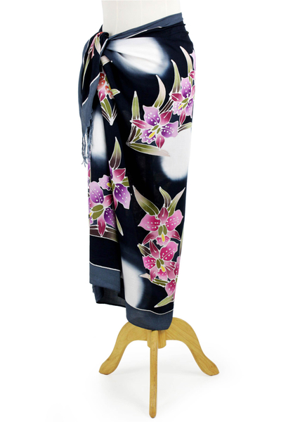 Rayon batik sarong, 'Luminous Orchids' - Artisan Crafted Black Rayon Sarong with Floral Motif