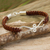 Leather and sterling silver braided bracelet, 'Brown Infinity Swirl' - Bracelet of Braided Brown Leather with Sterling Silver thumbail