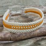 Silver beaded wristband bracelet, 'Orange and Cream' - Ivory and Orange Macrame Bracelet with Hill Tribe Silver
