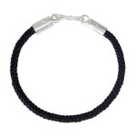 Braided leather bracelet, 'Elephant Promise in Black' - Braided Leather Cord Bracelet with Silver Elephant Clasp