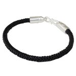 Braided leather bracelet, 'Elephant Promise in Black' - Braided Leather Cord Bracelet with Silver Elephant Clasp