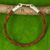 Braided leather bracelet, 'Elephant Promise in Brown' - Hand Crafted Leather Braided Bracelet with Elephant Motif thumbail