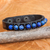Lapis lazuli and leather wristband bracelet, 'Rock Walk in Blue' - Artisan Crafted Lapis Lazuli and Leather Band Bracelet thumbail
