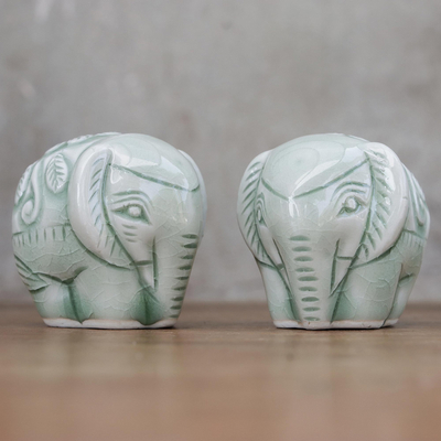 Celadon figurines, 'Elephant Paramours' (pair) - Pair of Handmade Thai Celadon Ceramic Elephant Figurines