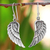 Sterling silver dangle earrings, 'Loving Wings' - Sterling Silver Wing Dangle Earrings from Thailand