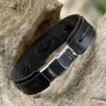 Leather wristband bracelet, 'Roadside Stroll in Black' - Hand Crafted Black Leather Wristband Bracelet from Thailand