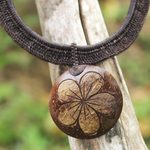 Coconut shell and leather flower pendant necklace, 'Rustic Frangipani in Black' - Handmade Black Leather and Coconut Shell Floral Necklace