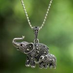 Garnet and marcasite pendant necklace, 'Glittering Elephants' - Garnet and Marcasite Elephant Pendant Necklace from Thailand