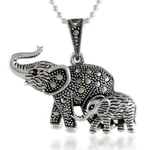 Garnet and marcasite pendant necklace, 'Glittering Elephants' - Garnet and Marcasite Elephant Pendant Necklace from Thailand