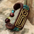Brass pendant wristband bracelet, 'Siam Fortress' - Brown Brass and Reconstituted Turquoise Wristband Bracelet (image 2) thumbail