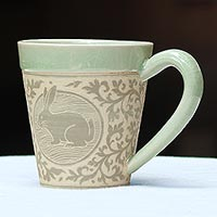 Celadon ceramic mug, 'Thai Zodiac Rabbit' - Celadon Glazed Ceramic Mug with Rabbit from Thailand