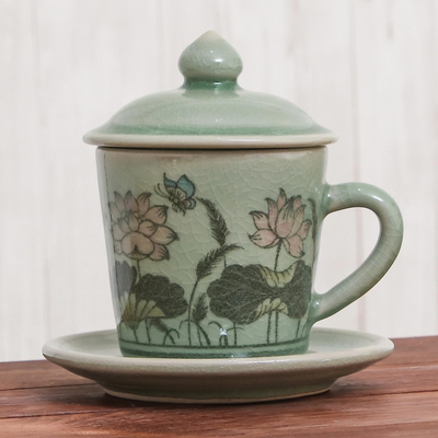 Celadon ceramic cup and saucer, 'Lanna Luxury' - Celadon Glazed Ceramic Floral Cup and Saucer from Thailand
