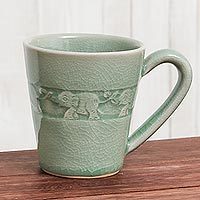 Celadon ceramic mug, 'Elephant Babies' - Hand Crafted Celadon Ceramic Elephant Mug from Thailand