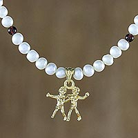Gold plated cultured pearl and garnet pendant necklace, 'Radiant Gemini' - Gold Plated Cultured Pearl and Garnet Gemini Necklace