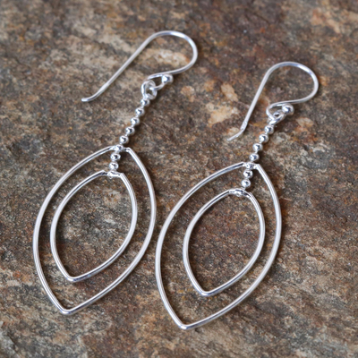 Sterling silver dangle earrings, 'Lotus Symmetry' - Long Sterling Silver Hook Earrings Handcrafted in Thailand