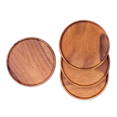 Wood plates, 'Natural Dark Discs' (set of 4) - Four Handcrafted Dark Raintree Wood Plates from Thailand