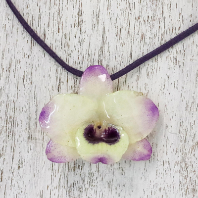 Natural flower pendant necklace, 'Orchid Treasure' - Resin-Coated Pale Yellow and Purple Orchid Pendant Necklace